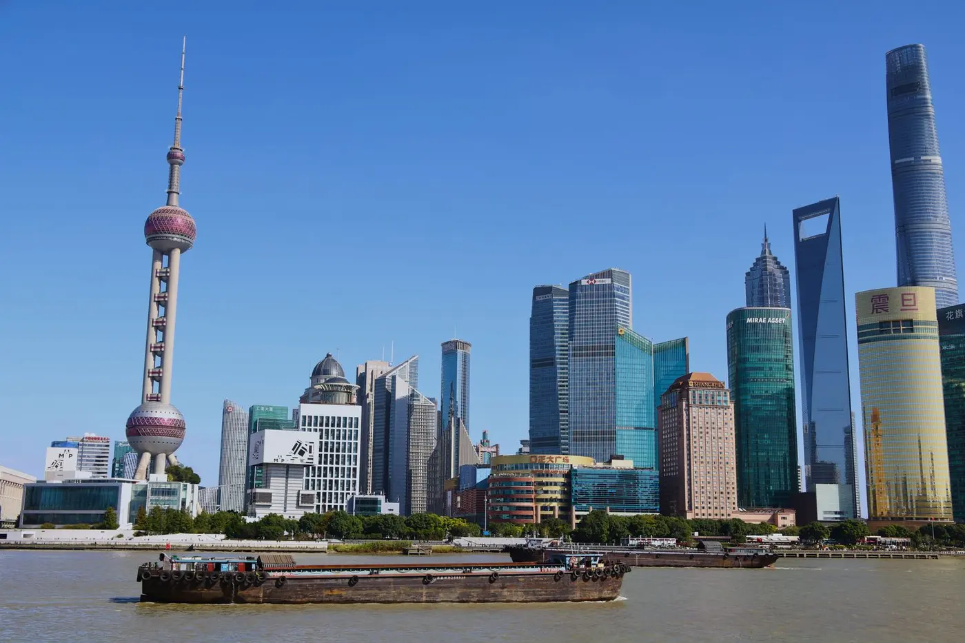 Aircraft over a Chinese skyline